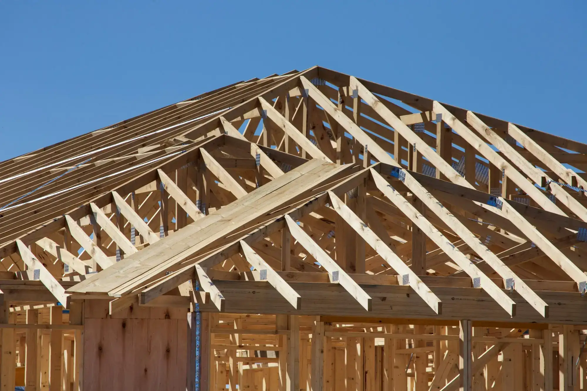 Wood roof trusses on a house under construction (stock photo)